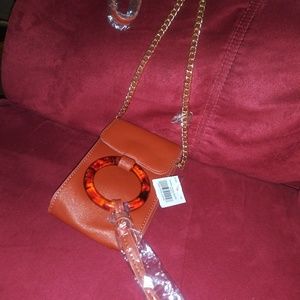 Tortoise cross body bag